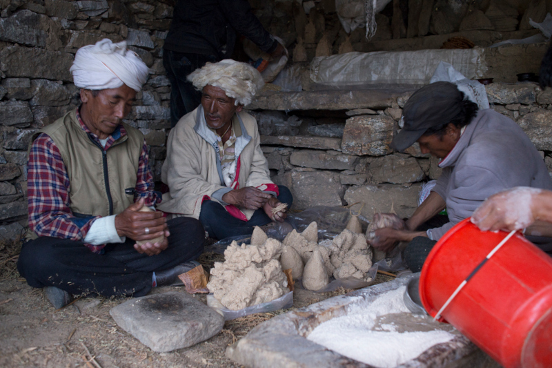Shamans making barley blessings for nature spirits